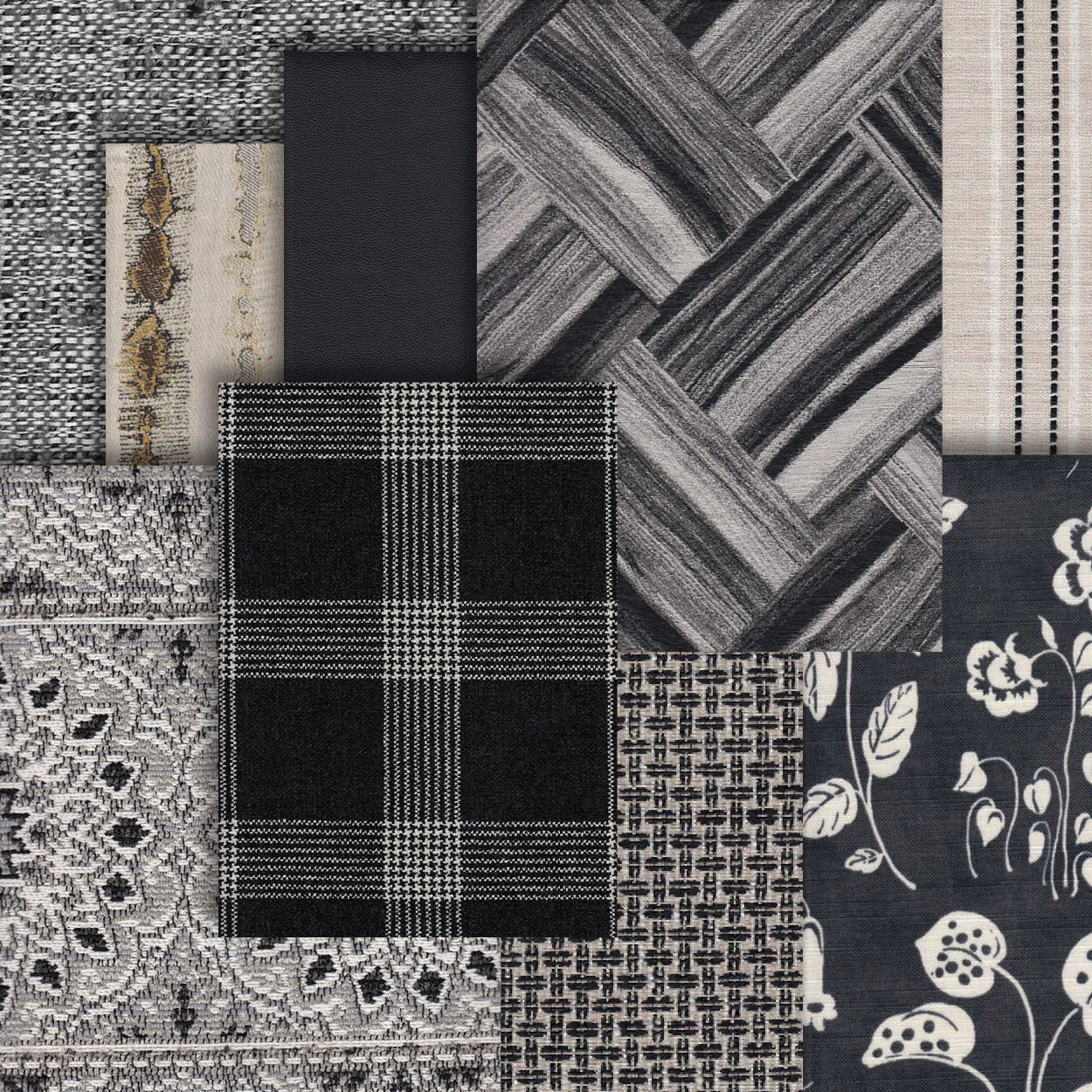 Various fabrics in different textures and patterns lay atop one another in various shades of grey and black