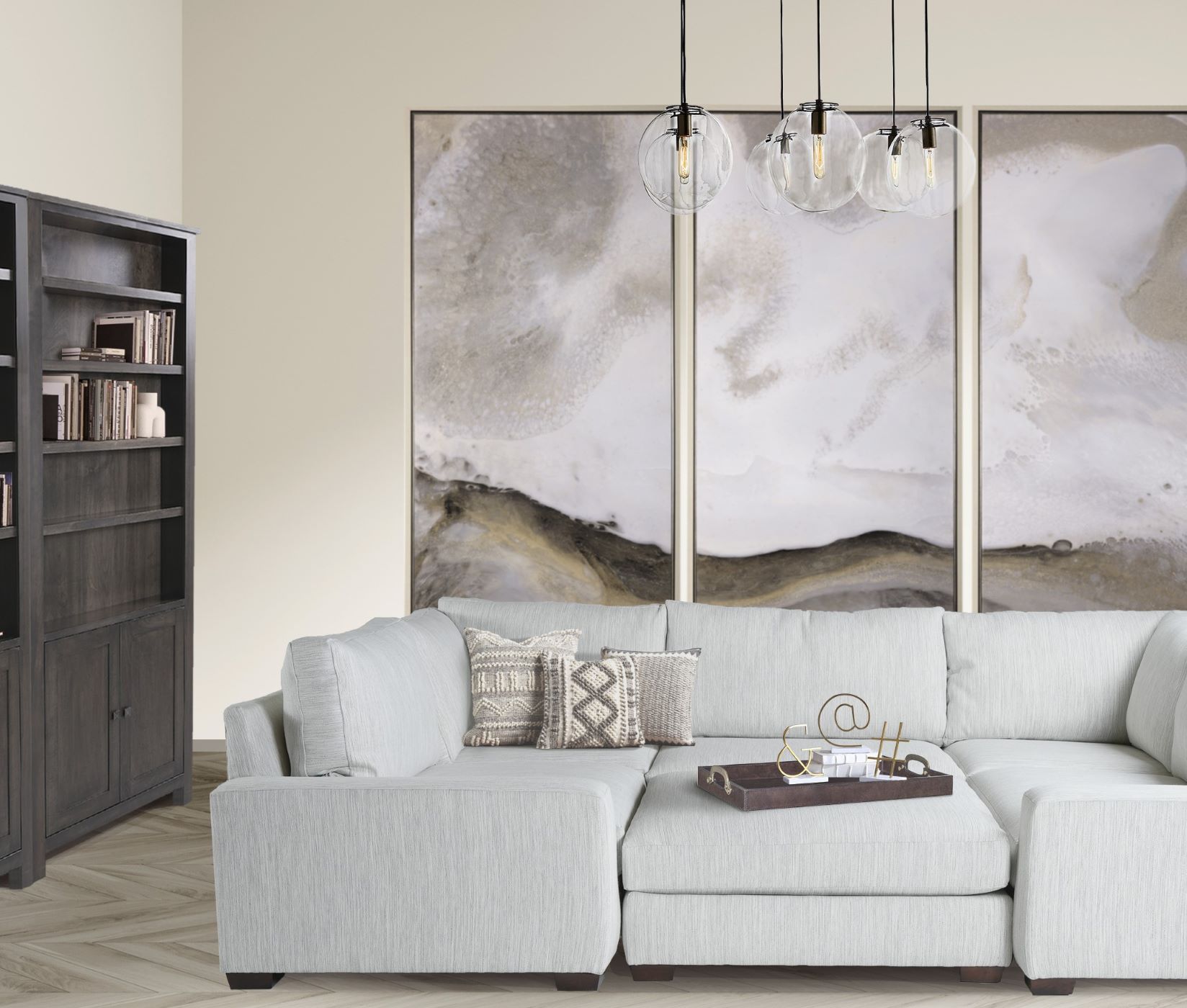 The Miles Sectional  Sofa and Sherwood Bookcase sit in a modern living room with large paintings on the wall